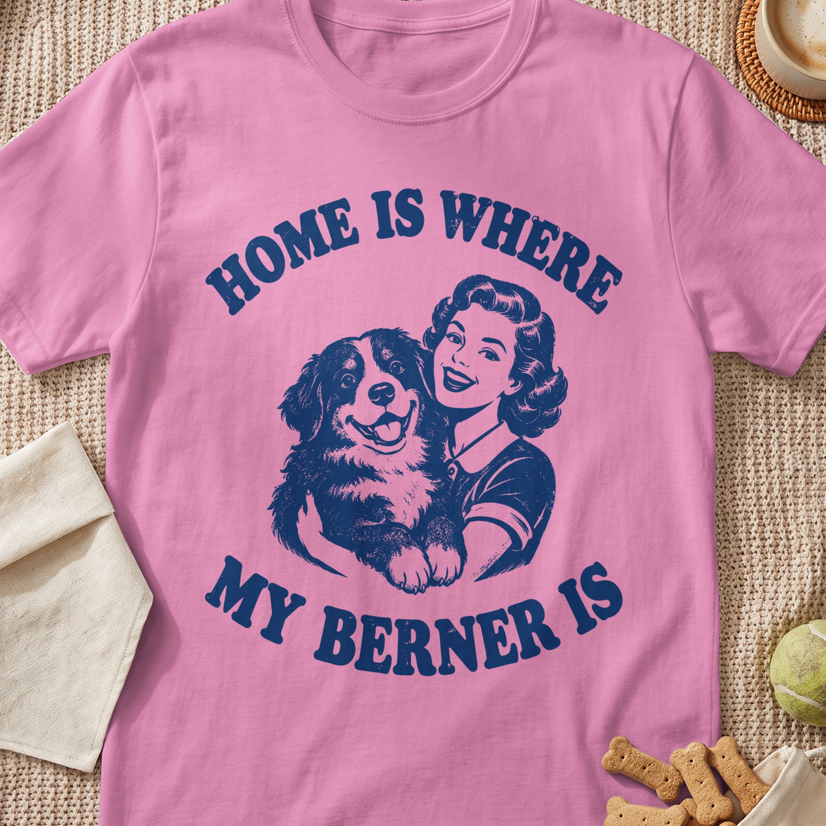 Pink t-shirt with navy graphic: "Home is Where My Berner Is" and a woman hugging a dog.