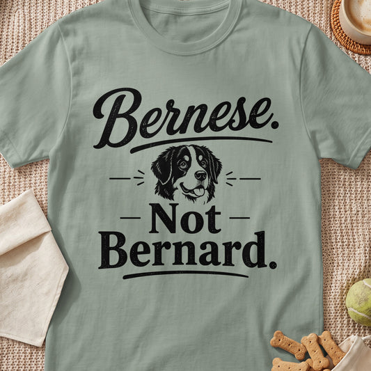 Green t-shirt with black text "Bernese. - Not - Bernard." and a dog illustration.