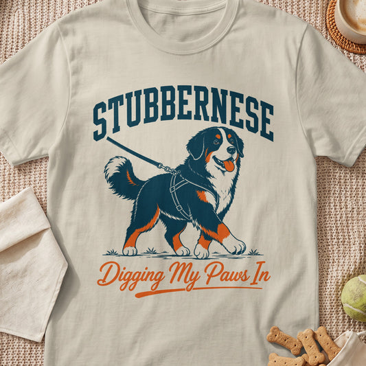 Bernese Mountain Dog walking on leash with text "Stubbernese Digging My Paws In".
