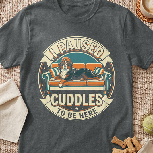 Bernese Mountain Dog on couch with sunglasses, text "I paused cuddles to be here".