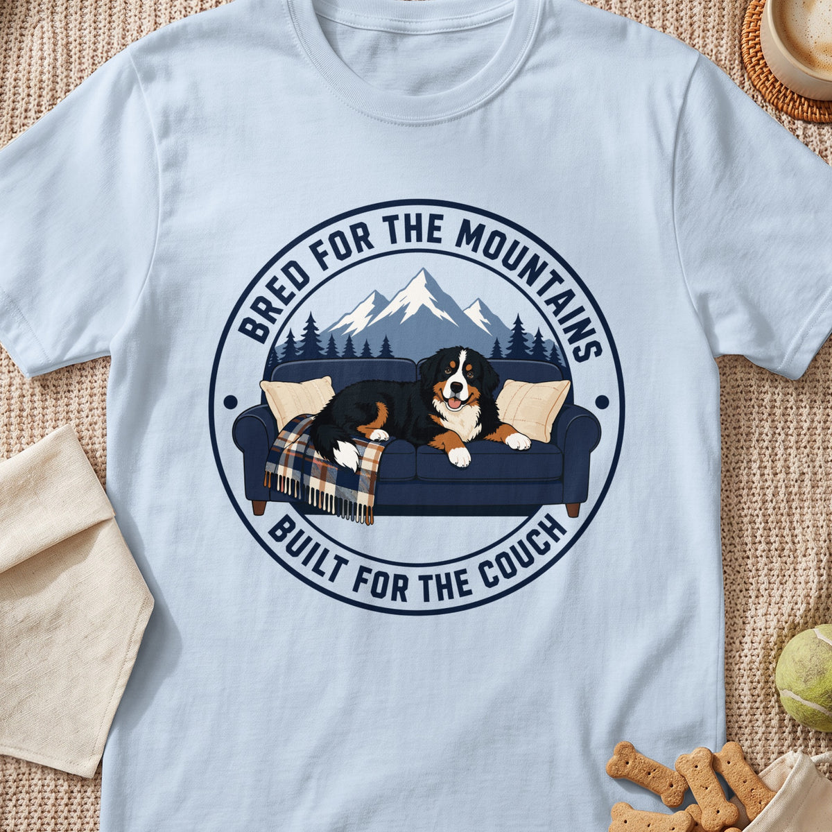 Bernese Mountain Dog on couch with text "Bred for the Mountains, Built for the Couch."