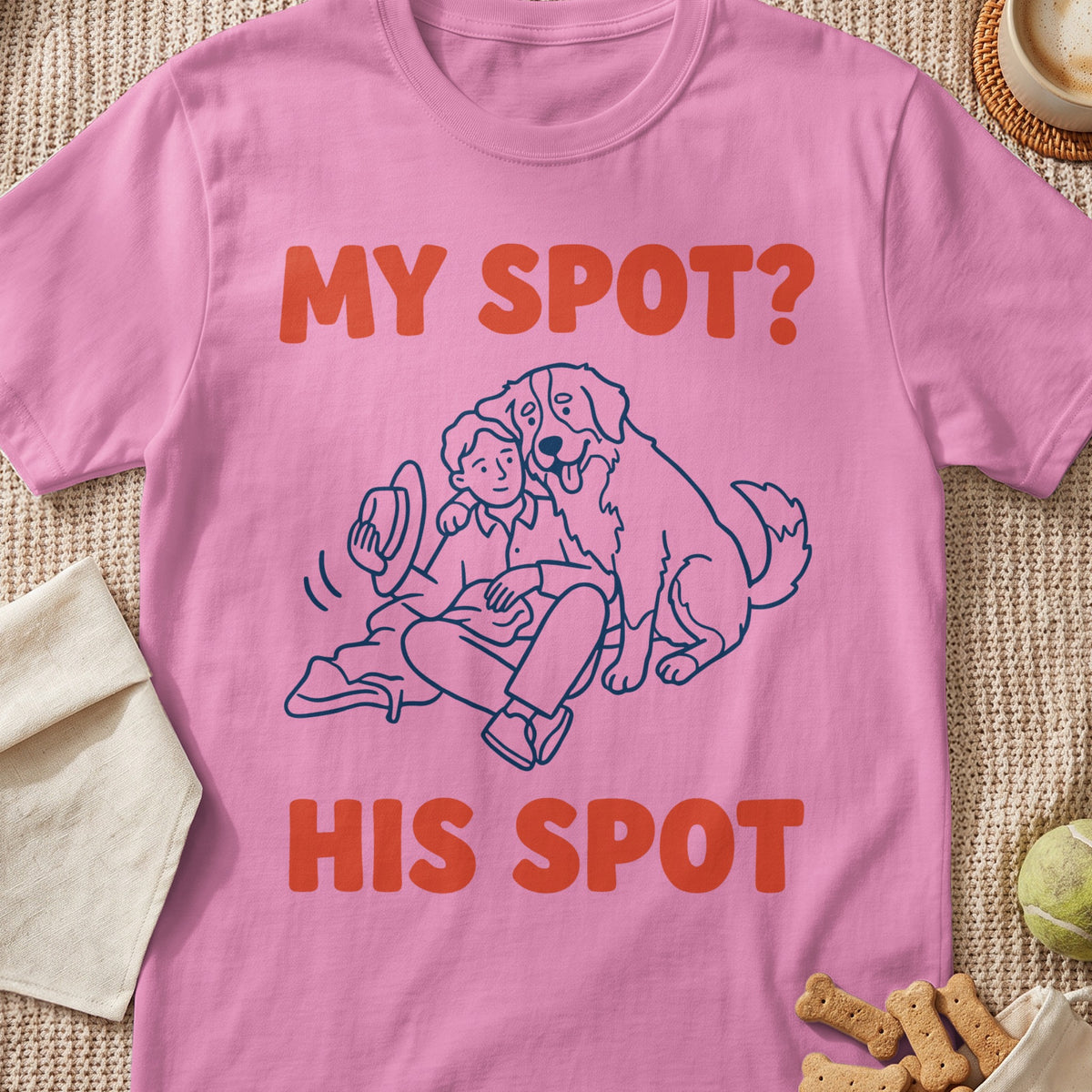 Pink t-shirt with graphic of a person and dog, text reads "MY SPOT? HIS SPOT".