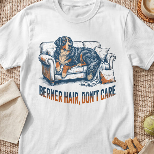 Bernese Mountain Dog lounging on a couch with text "BERNER HAIR, DON'T CARE".