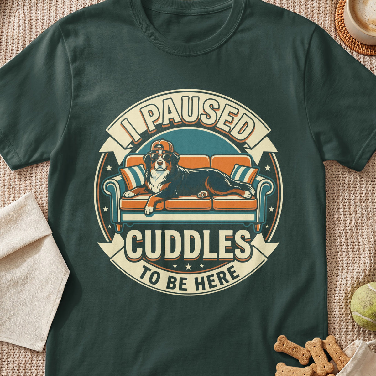 Bernese Mountain Dog wearing sunglasses and cap on couch, "I paused cuddles to be here" text.