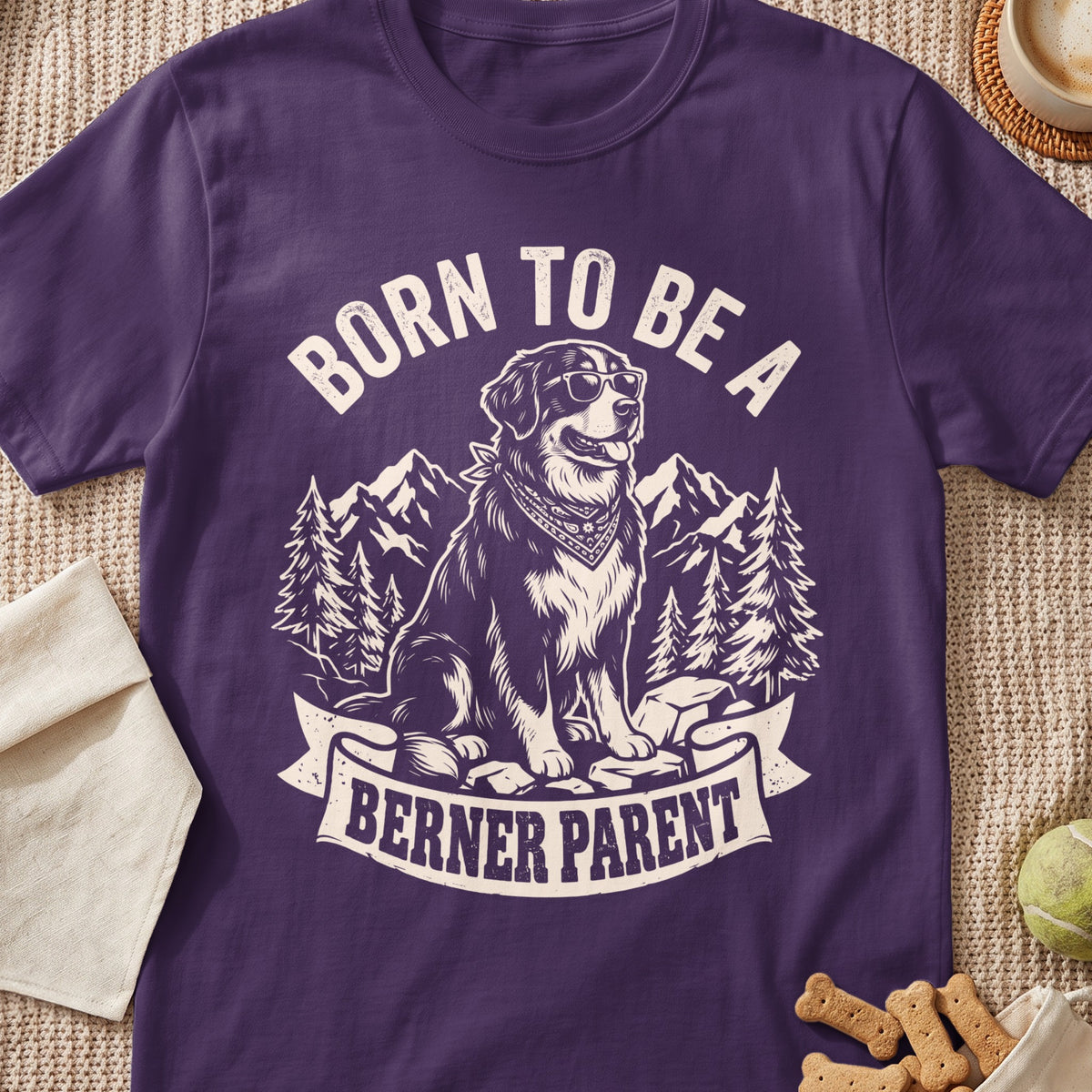 T-shirt graphic with a dog wearing sunglasses and bandana, saying "Born to be a Berner Parent".