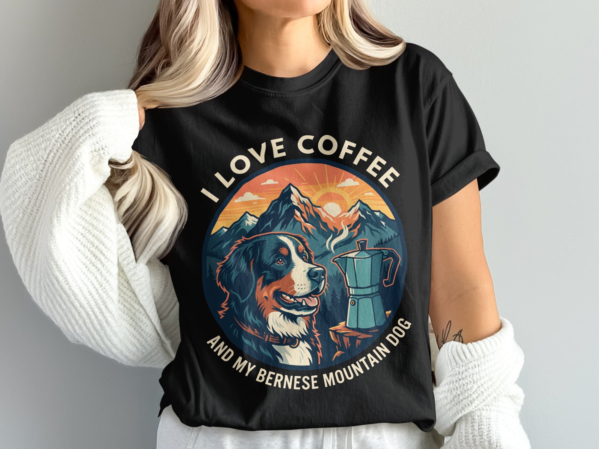Black t-shirt graphic with Bernese Mountain Dog, coffee pot, mountains and text "I LOVE COFFEE AND MY BERNESE MOUNTAIN DOG".
