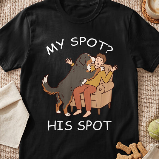 Black t-shirt with illustration of a dog licking a man on the couch and text "MY SPOT? HIS SPOT".