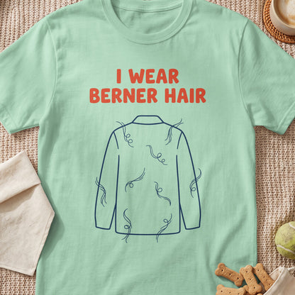 Light green t-shirt with orange text "I WEAR BERNER HAIR" and a blue outline of a dog covered in fur.