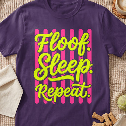 Purple t-shirt with "Floof Sleep Repeat" text in neon yellow on a pink striped background.