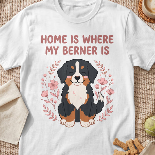 White t-shirt with a cartoon Bernese Mountain Dog and the text "Home is where my Berner is".