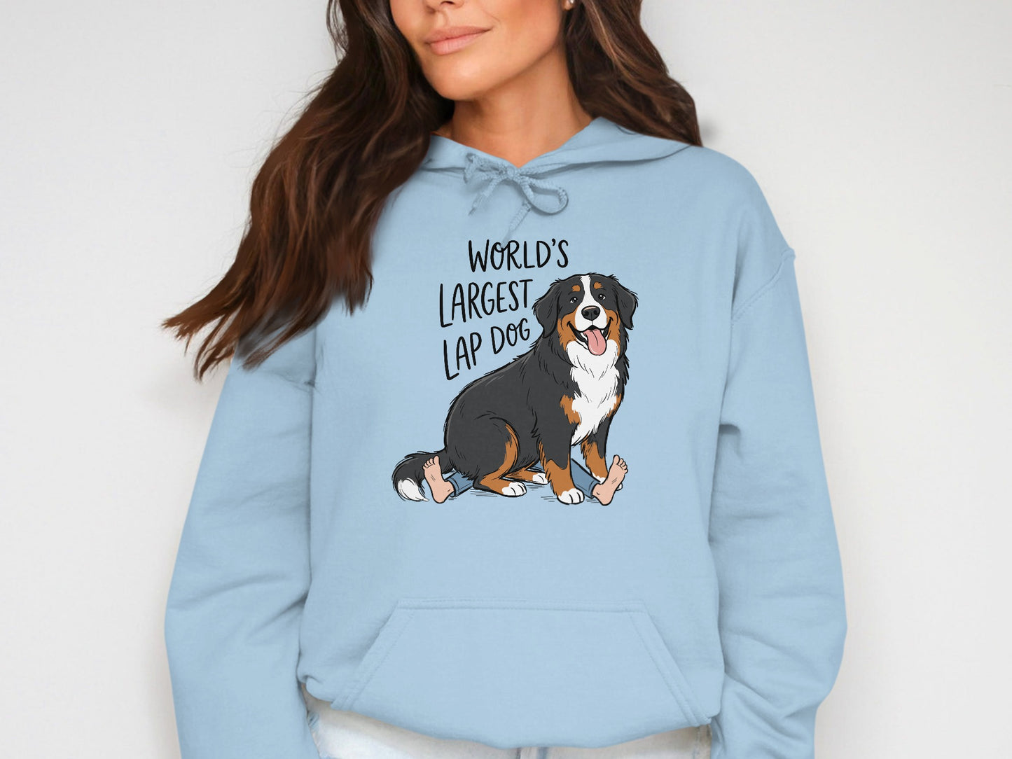 Light blue hoodie with cartoon Bernese Mountain Dog and text "World's Largest Lap Dog".