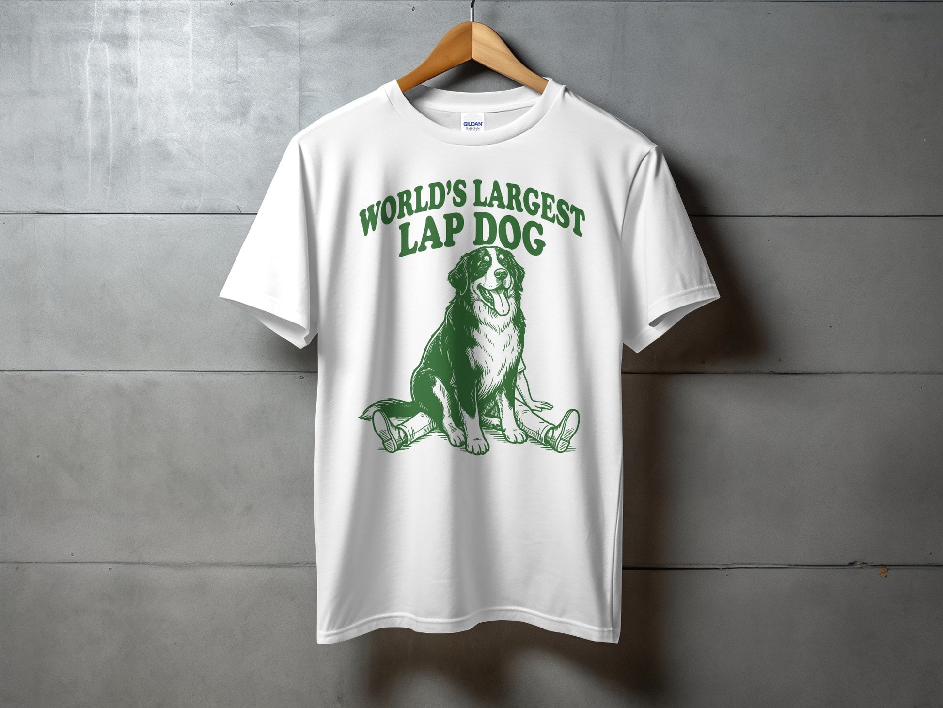 White t-shirt with green text "WORLD'S LARGEST LAP DOG" and a dog illustration.