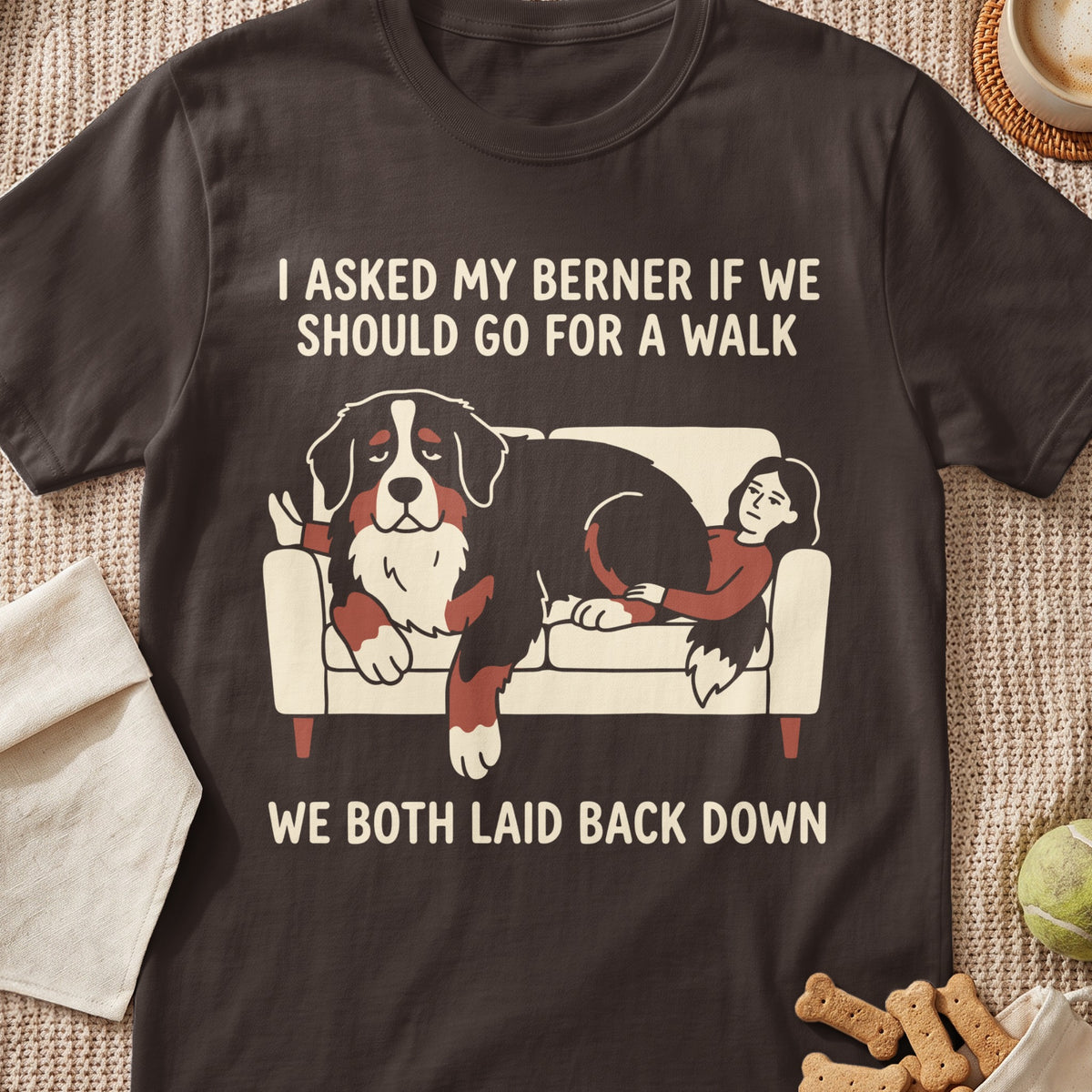Bernese Mountain Dog and person lounging on couch with text "We Both Laid Back Down".