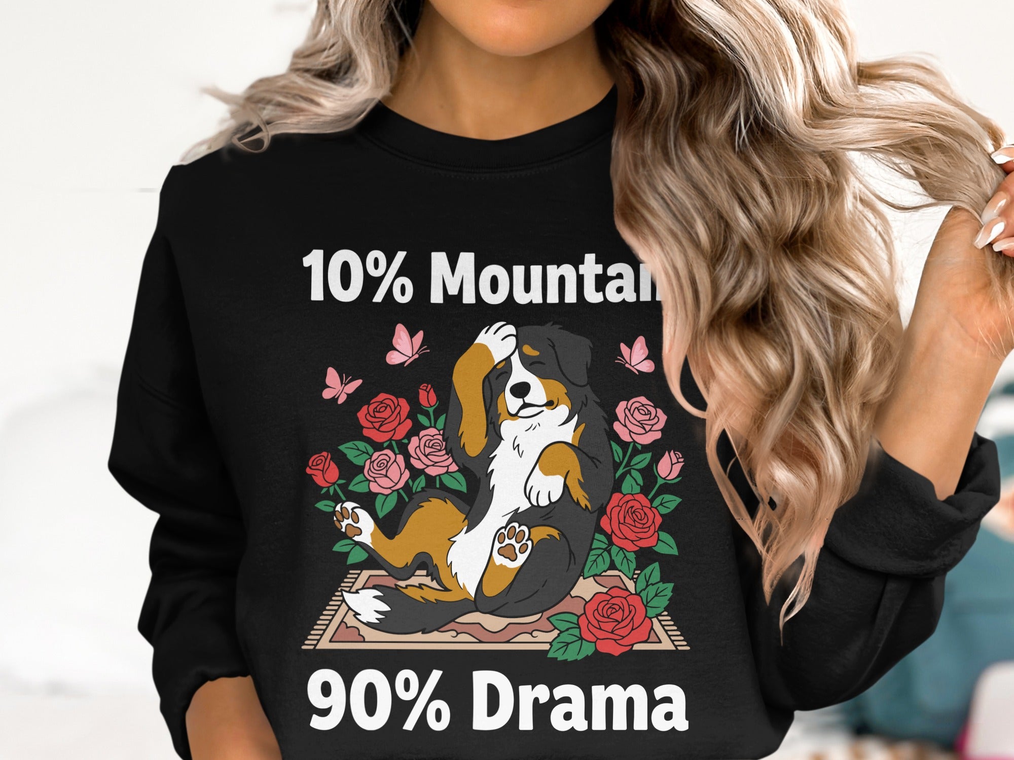 Black sweatshirt with a Bernese Mountain Dog and roses graphic reading "10% Mountain 90% Drama."