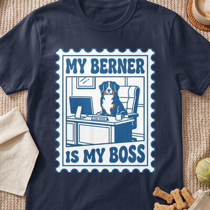 Navy blue t-shirt featuring a graphic of a Bernese Mountain Dog at an office desk with text reading My Berner Is My Boss.