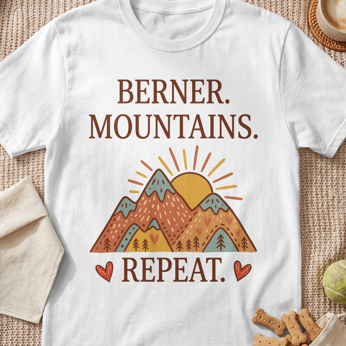 White t-shirt with "Berner. Mountains. Repeat." and mountain graphic.