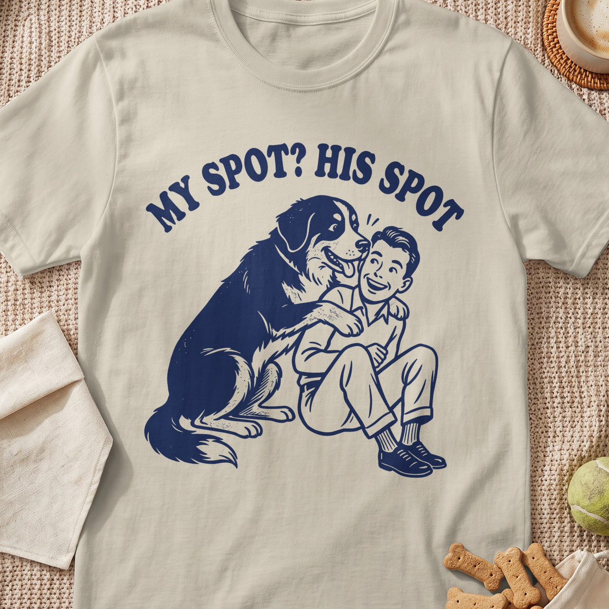 T-shirt with blue graphic of a dog and boy with text "MY SPOT? HIS SPOT".
