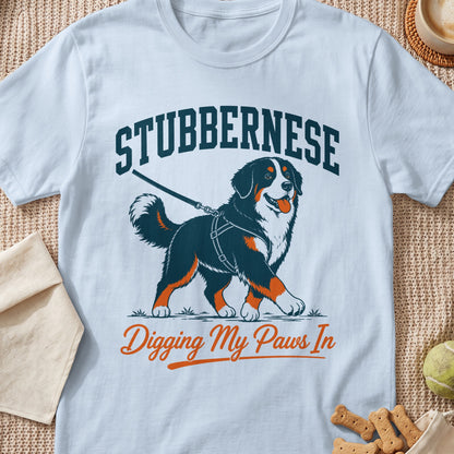 Bernese Mountain Dog walking on leash with text "STUBBERNESE" and "Digging My Paws In".
