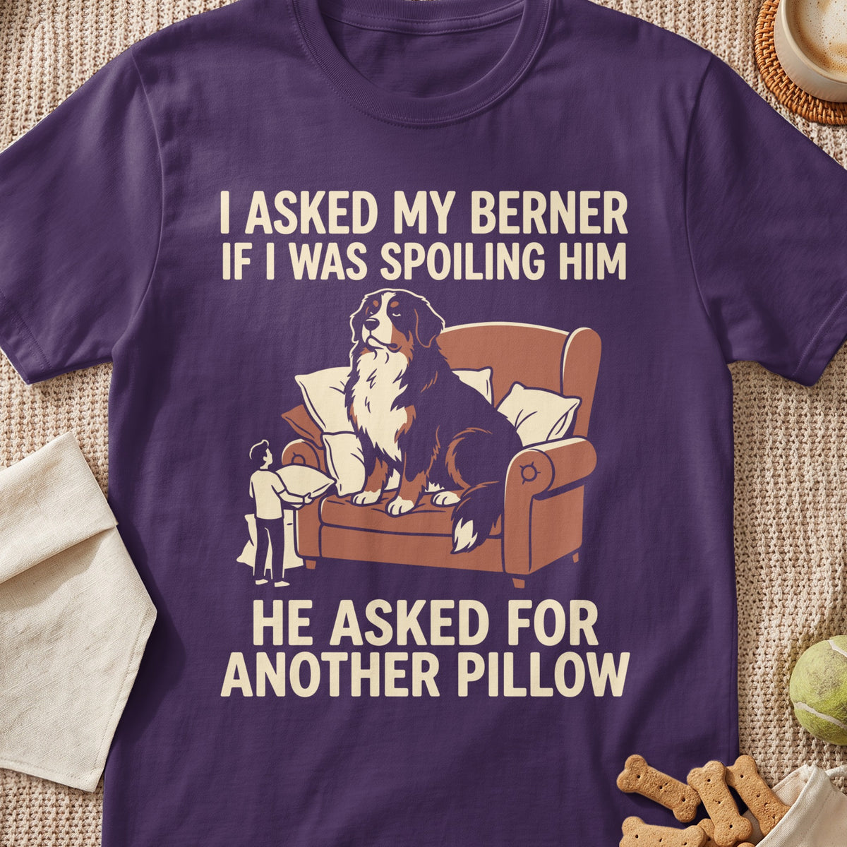 Bernese Mountain Dog sits on couch with text: I asked my Berner if I was spoiling him. He asked for another pillow.