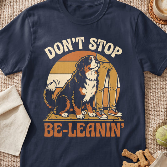 Bernese Mountain Dog sitting next to person, text "DON'T STOP BE-LEANIN'".