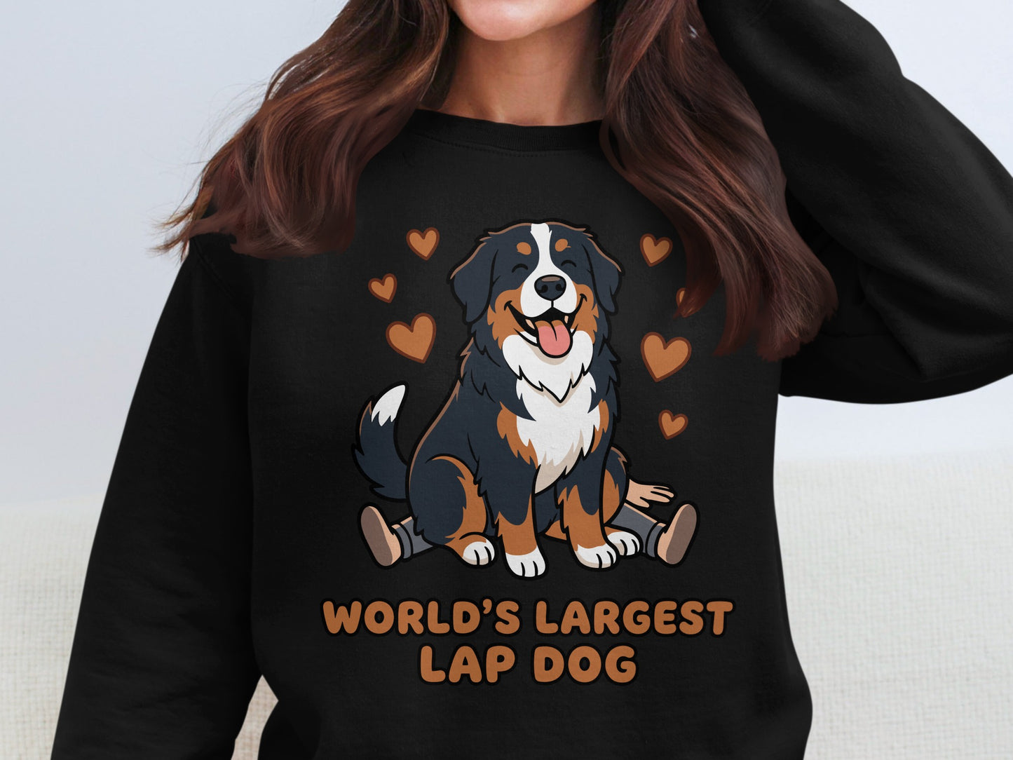 Bernese Mountain Dog graphic on black sweatshirt with text "WORLD'S LARGEST LAP DOG".