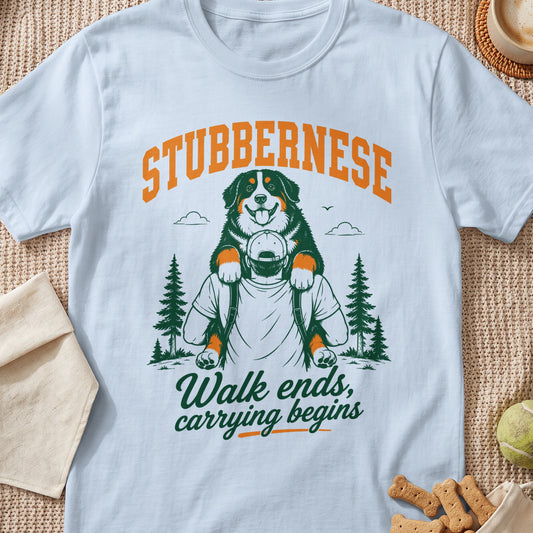 White t-shirt with "STUBBERNESE" and a dog on shoulders, "Walk ends, carrying begins."
