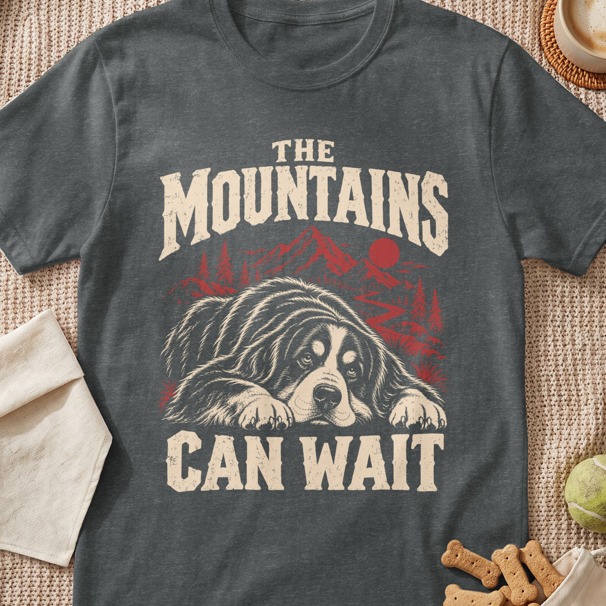 Dark grey t-shirt with "The Mountains Can Wait" text and a resting dog graphic.