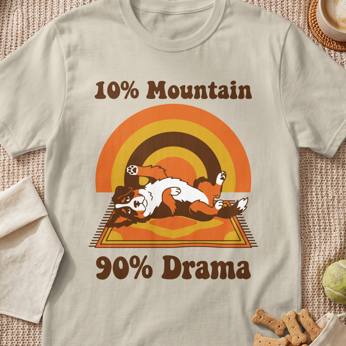 Bernese Mountain Dog lying on its back with text "10% Mountain 90% Drama".
