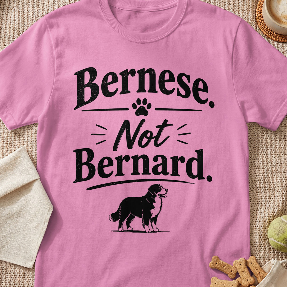 Pink t-shirt with text "Bernese. Not Bernard." and a dog illustration.