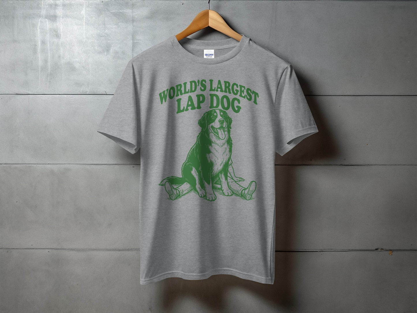 Grey t-shirt with green graphic of a dog and text "WORLD'S LARGEST LAP DOG".