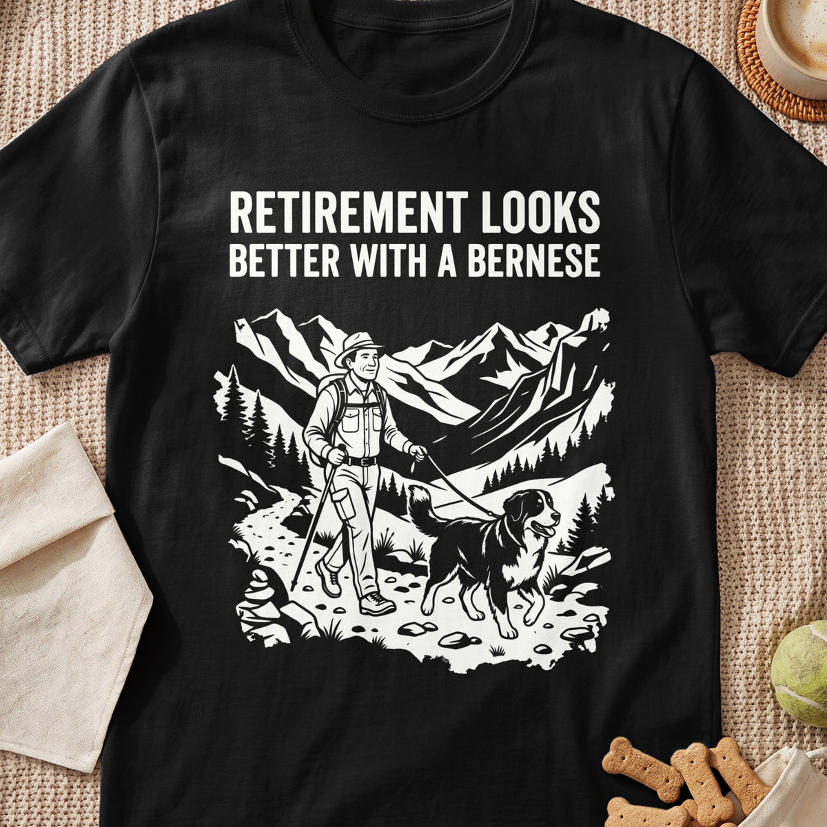 T-shirt with text "Retirement looks better with a Bernese" and hiker with dog.