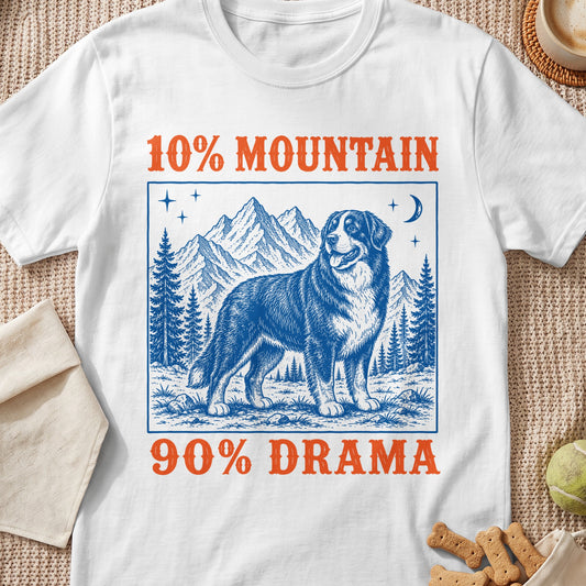 White t-shirt with blue and orange graphic of a dog, mountains, and trees, reading "10% MOUNTAIN 90% DRAMA".