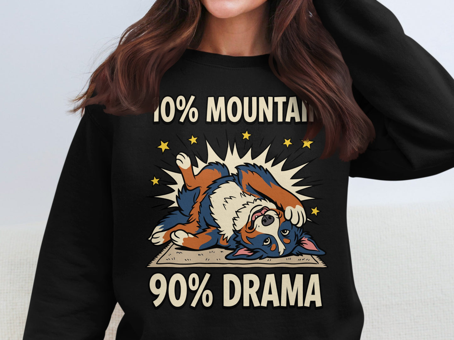 Black sweatshirt with illustration of dog on back and text "10% MOUNTAIN 90% DRAMA".