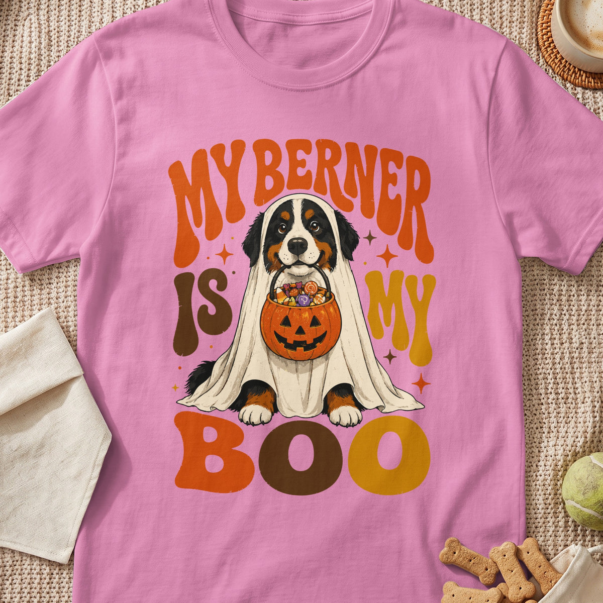 Bernese Mountain Dog dressed as a ghost holding a pumpkin candy bucket with text MY BERNER IS MY BOO.