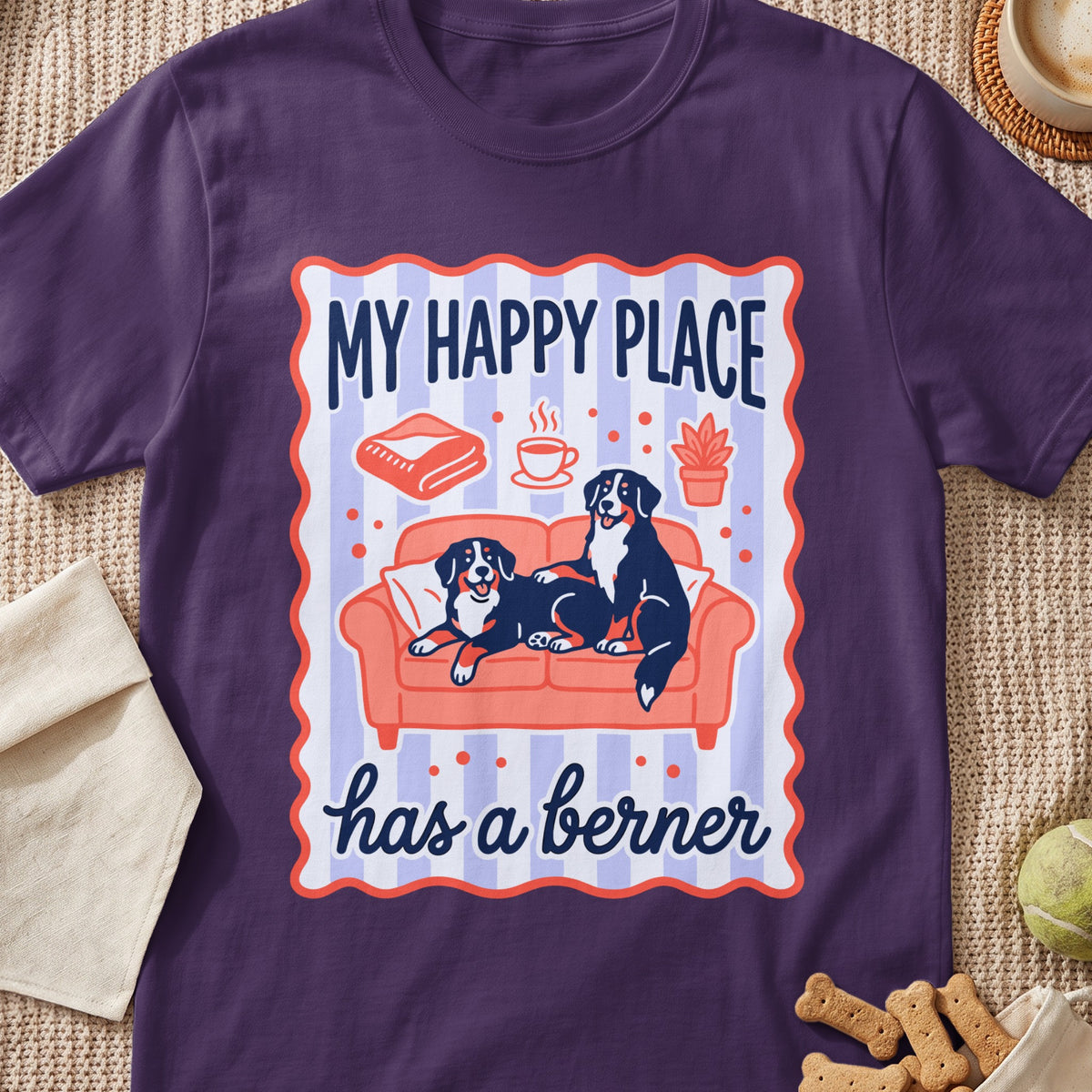 Purple t-shirt graphic with two Bernese Mountain Dogs on a sofa and text "MY HAPPY PLACE has a berner".