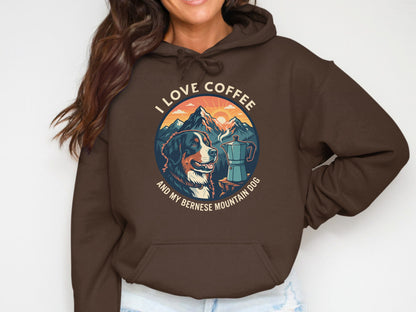 Brown hoodie with a circular graphic of a Bernese Mountain Dog, coffee pot, and mountains.