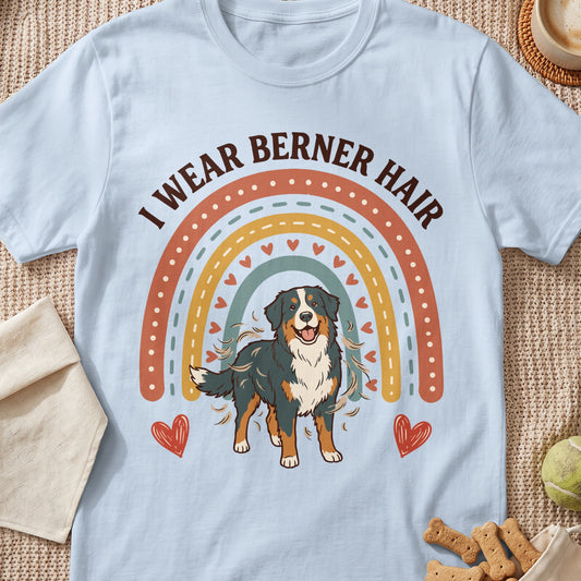 Bernese Mountain Dog on pastel t-shirt with rainbow graphic and text "I wear Berner hair."