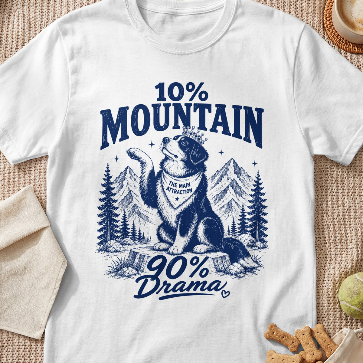 Dog wearing crown and bandana with text "The Main Attraction", 10% Mountain 90% Drama.