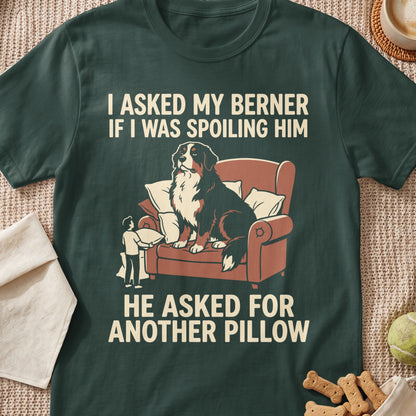 Bernese Mountain Dog on couch with text: "I asked my Berner if I was spoiling him. He asked for another pillow."
