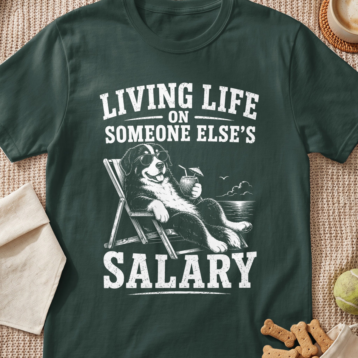 Bernese Mountain Dog relaxing on a beach chair with a drink, text "Living Life On Someone Else's Salary".