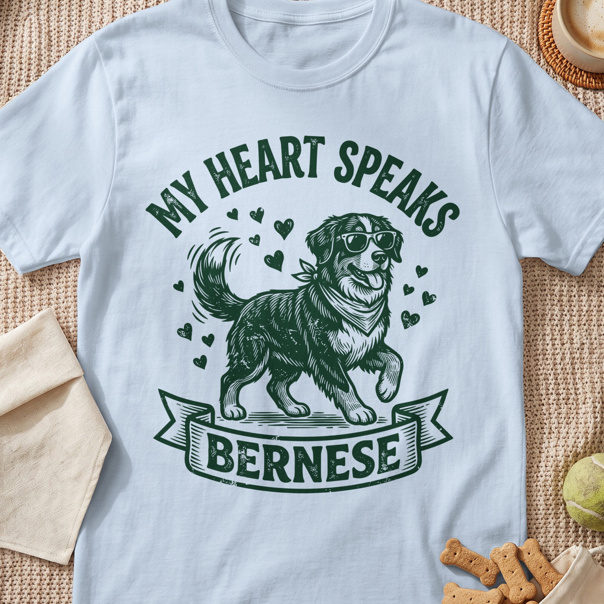 Light blue t-shirt with green "My Heart Speaks Bernese" text and a dog graphic.