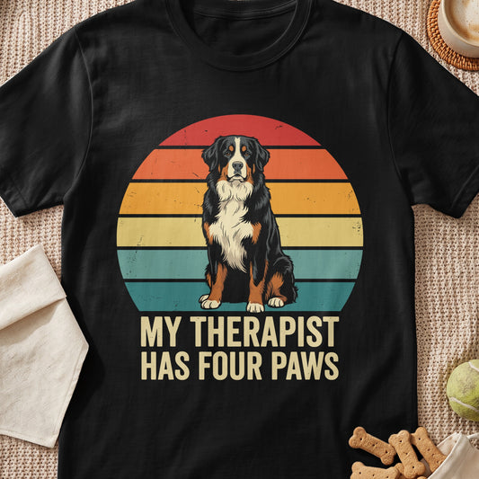 Black t-shirt with vintage sunset graphic and text "MY THERAPIST HAS FOUR PAWS".