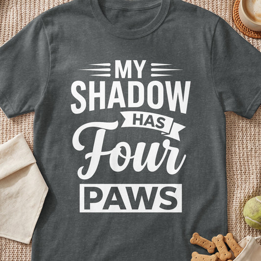 Dark gray t-shirt with white text "MY SHADOW HAS FOUR PAWS"