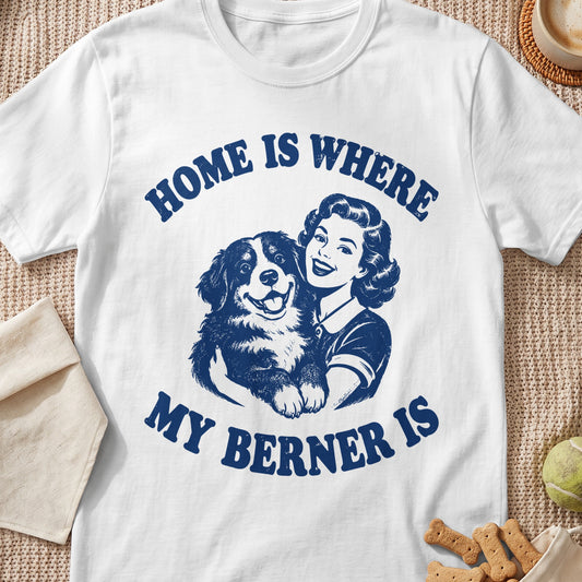 White t-shirt with blue text and illustration of a woman holding a Bernese Mountain Dog.