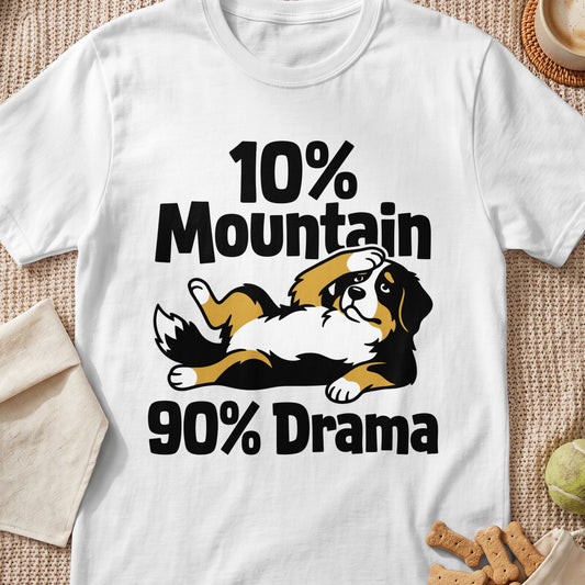 White t-shirt featuring an illustration of a Bernese Mountain Dog lying down with text reading "10% Mountain 90% Drama".