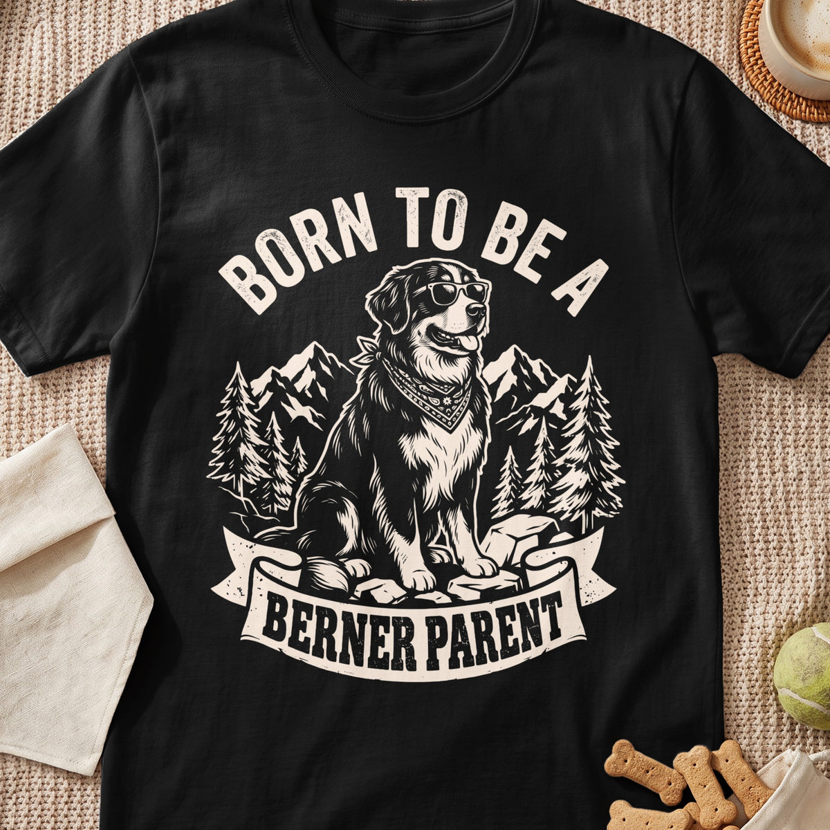 Black t-shirt graphic featuring a dog with sunglasses and bandana, text "Born to be a Berner Parent".