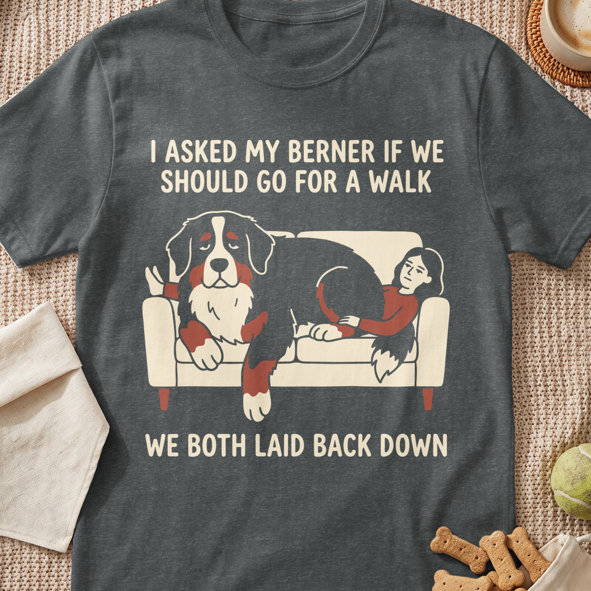 Bernese Mountain Dog and person relaxing on couch with text "We both laid back down".