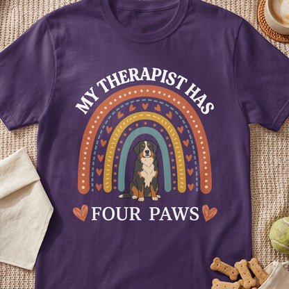 Purple t-shirt with rainbow graphic and text "MY THERAPIST HAS FOUR PAWS".
