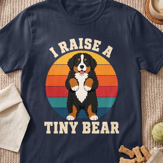 Bernese Mountain Dog with text "I RAISE A TINY BEAR" on a navy t-shirt.