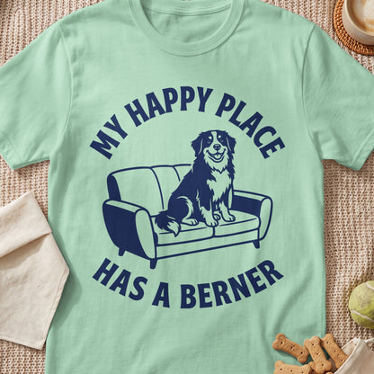 Mint t-shirt with navy blue text "MY HAPPY PLACE HAS A BERNER" and dog on couch graphic.